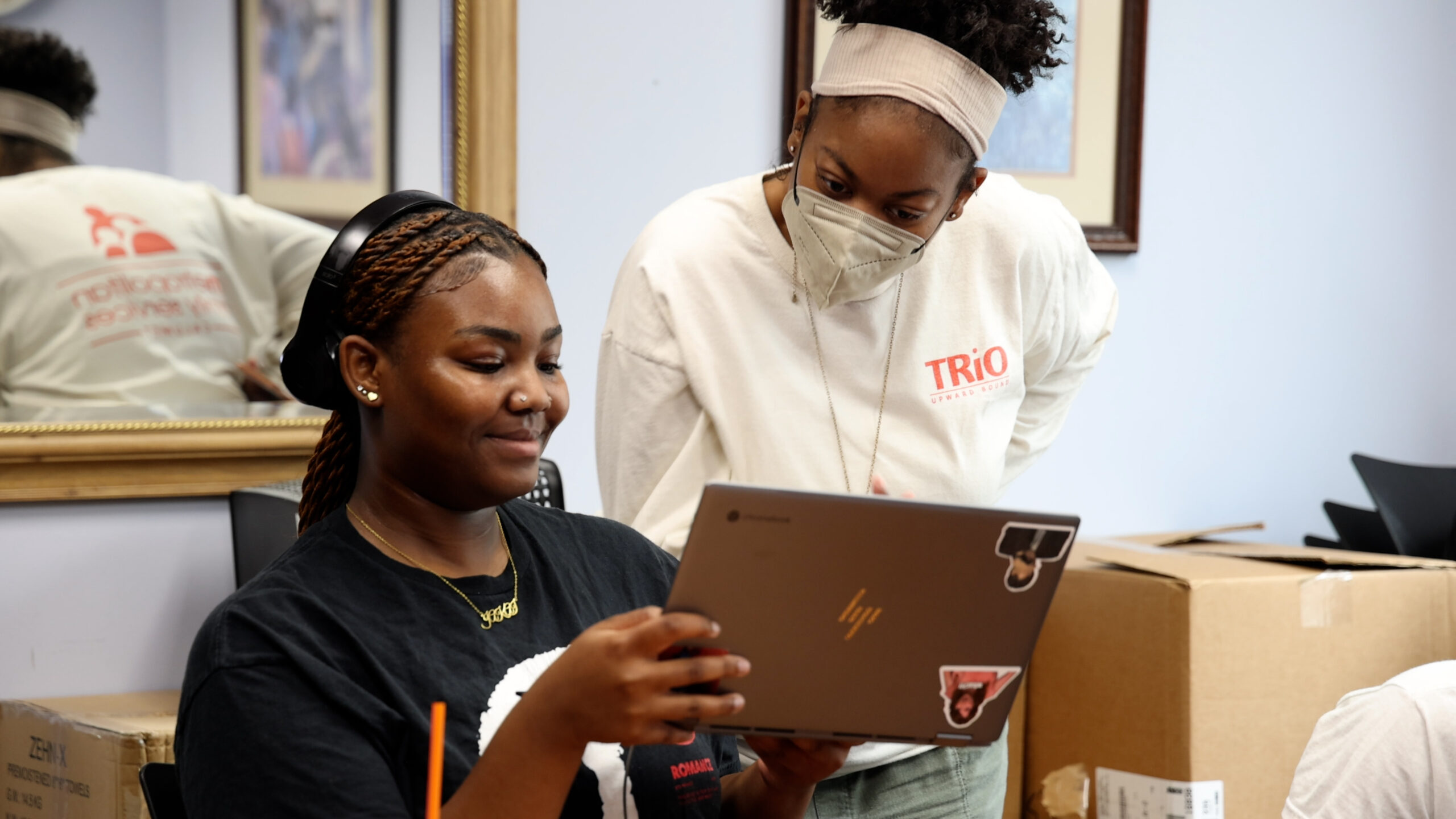 Two people learning on their computer.